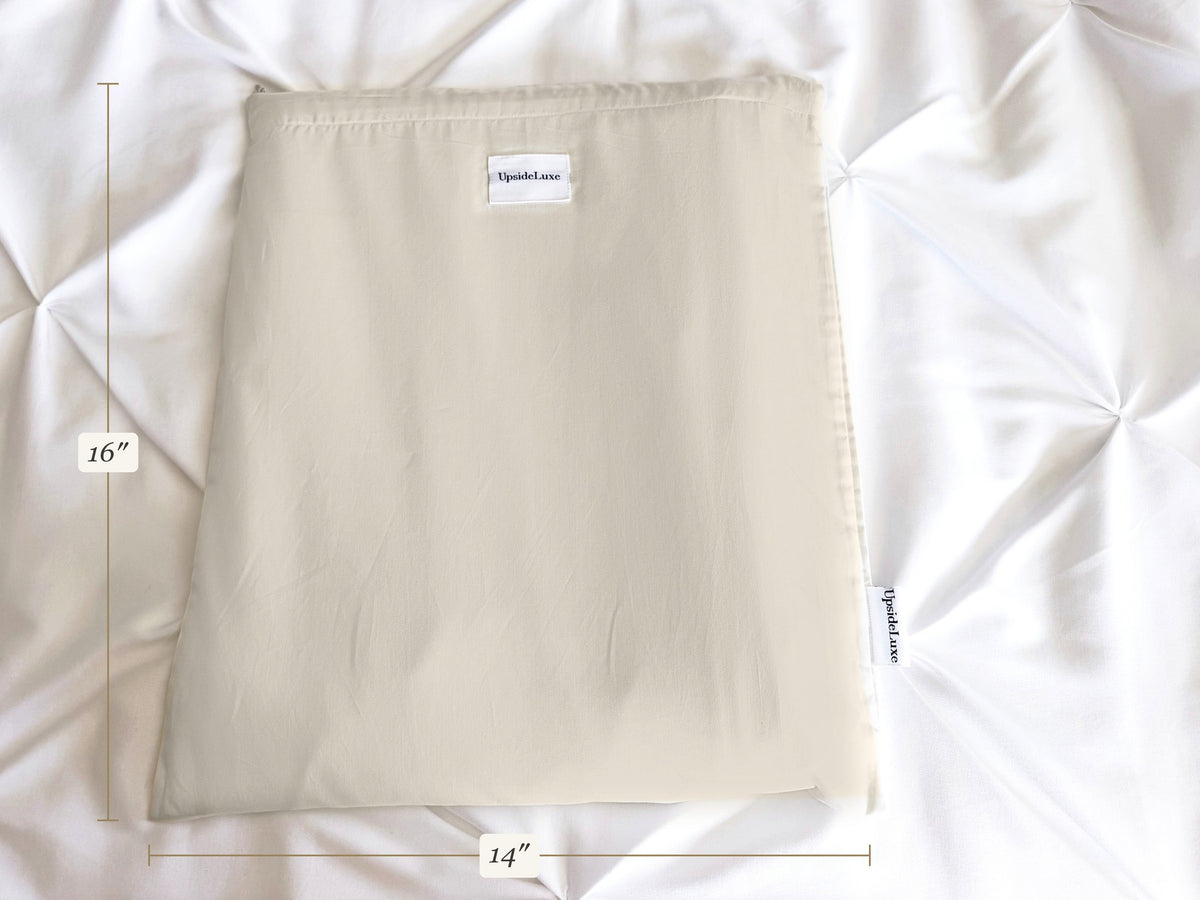 UpsideLuxe Sleep Sack packed flat in its 14 by 16 inch Supima sateen envelope

