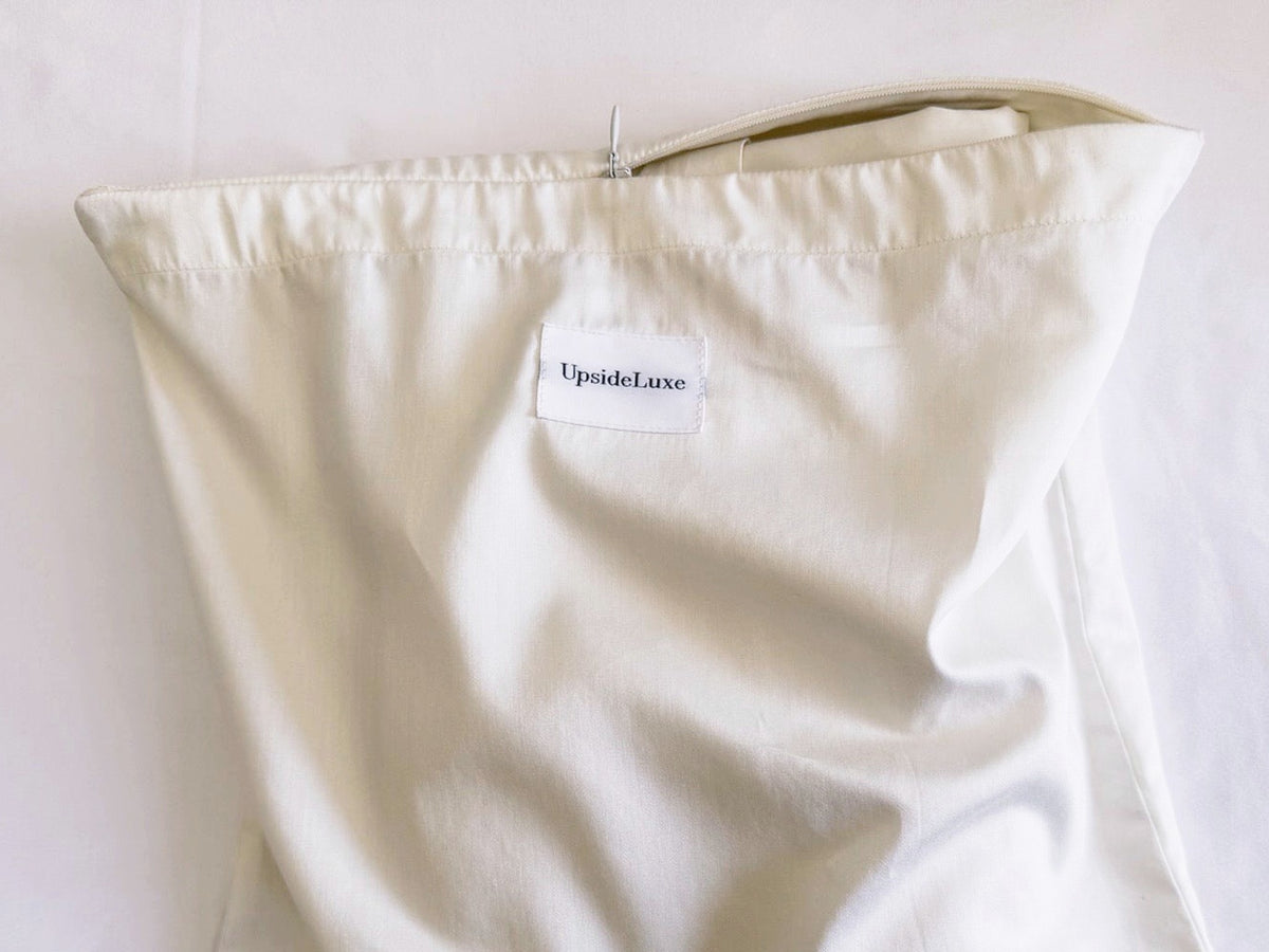 Close-up of the concealed zipper on the UpsideLuxe Supima sateen packing envelope